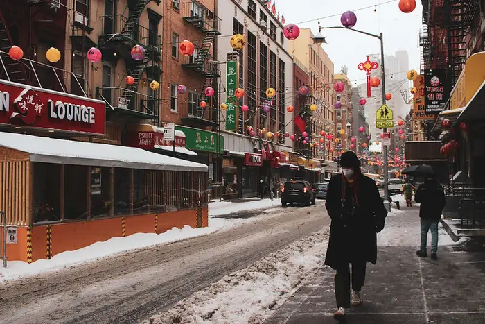 light snow falls in Chinatown